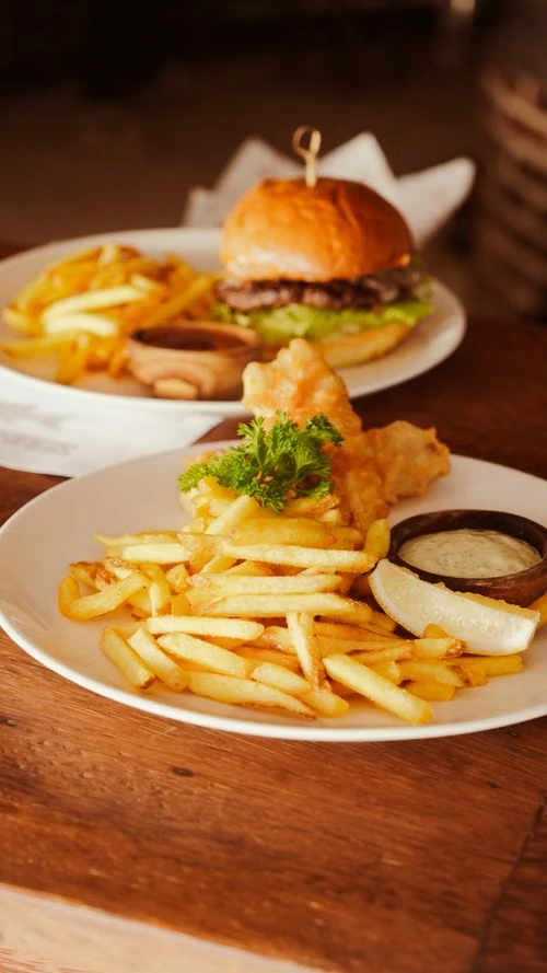 Gourmet burger and fries at Ethos Greek Bistro